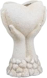 Hands holding heart planter