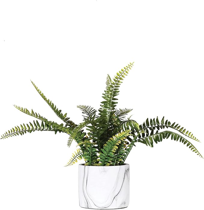 Artificial fern plant in marble pot décor