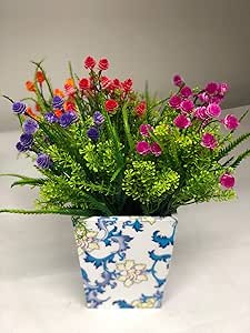 Artificial flower plant in flowery vase