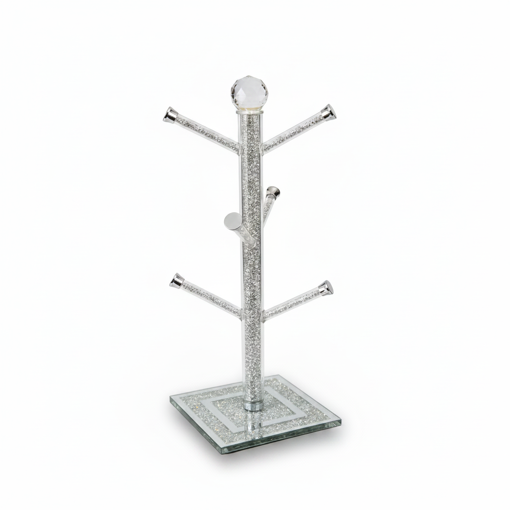 Silver jewelry tree with a square glass base on a white background
