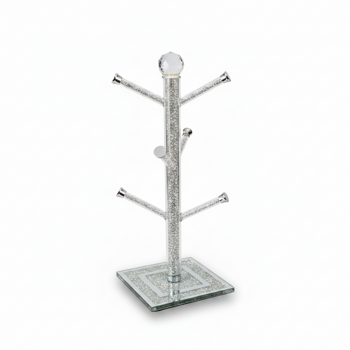 Silver jewelry tree with a square glass base on a white background