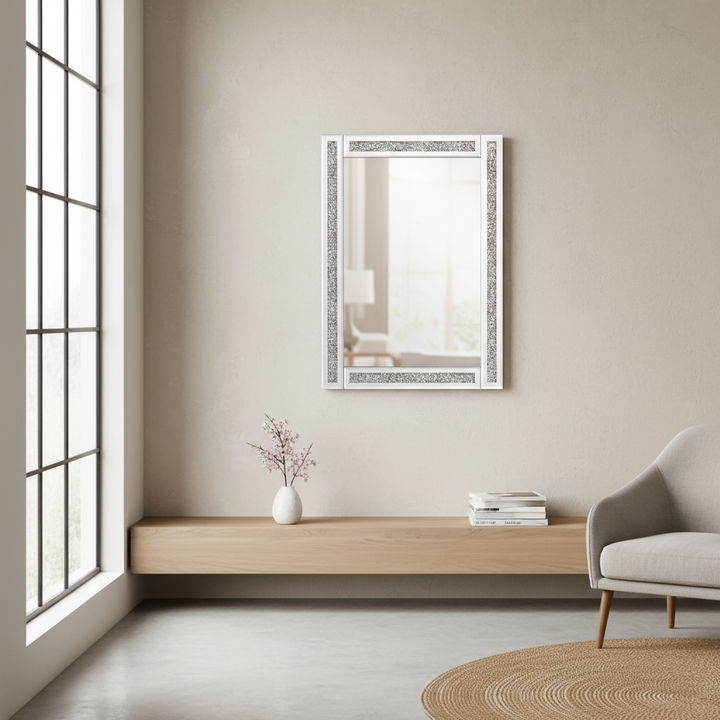 Modern interior with a mirror on the wall, wooden shelf, and gray armchair.