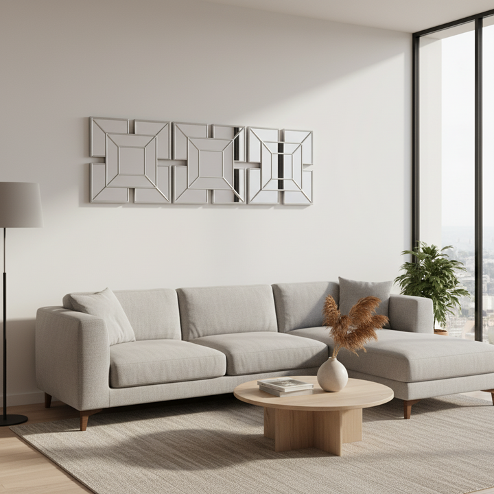 Modern living room with a gray sectional sofa, wooden coffee table, and decorative elements.