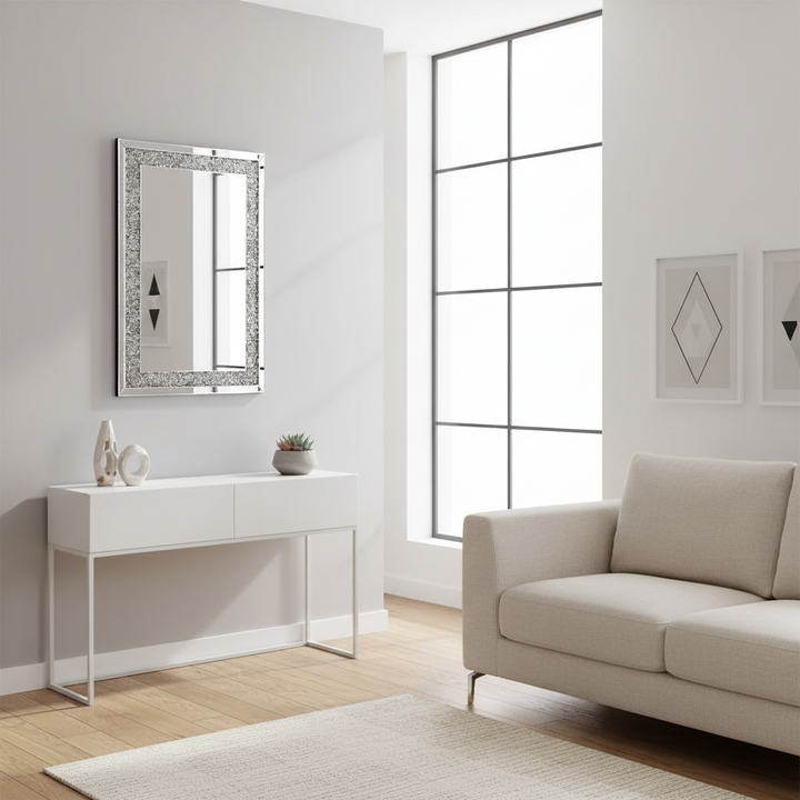 Modern living room with a white console table, mirror, and beige sofa.