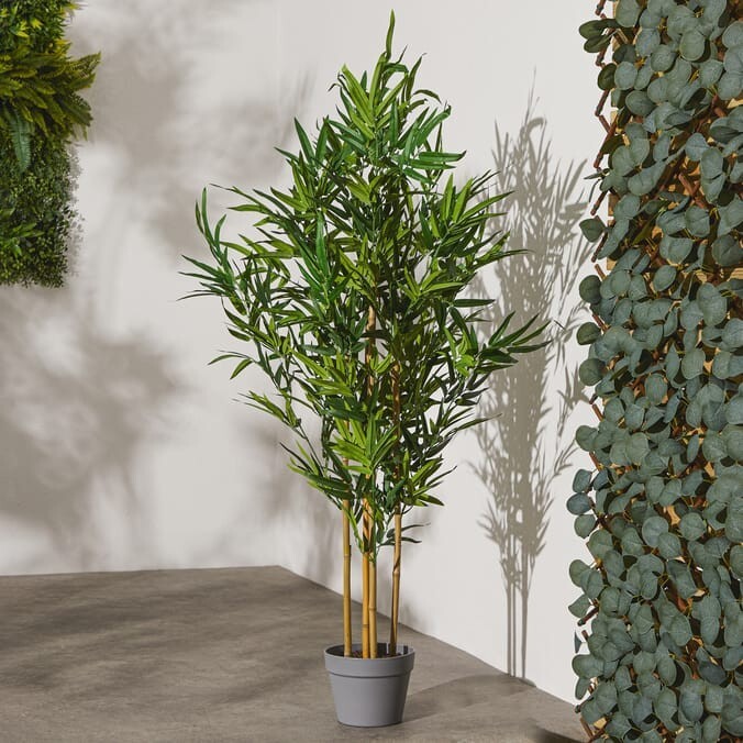 Artificial bamboo plant in grey pot tall indoor plant