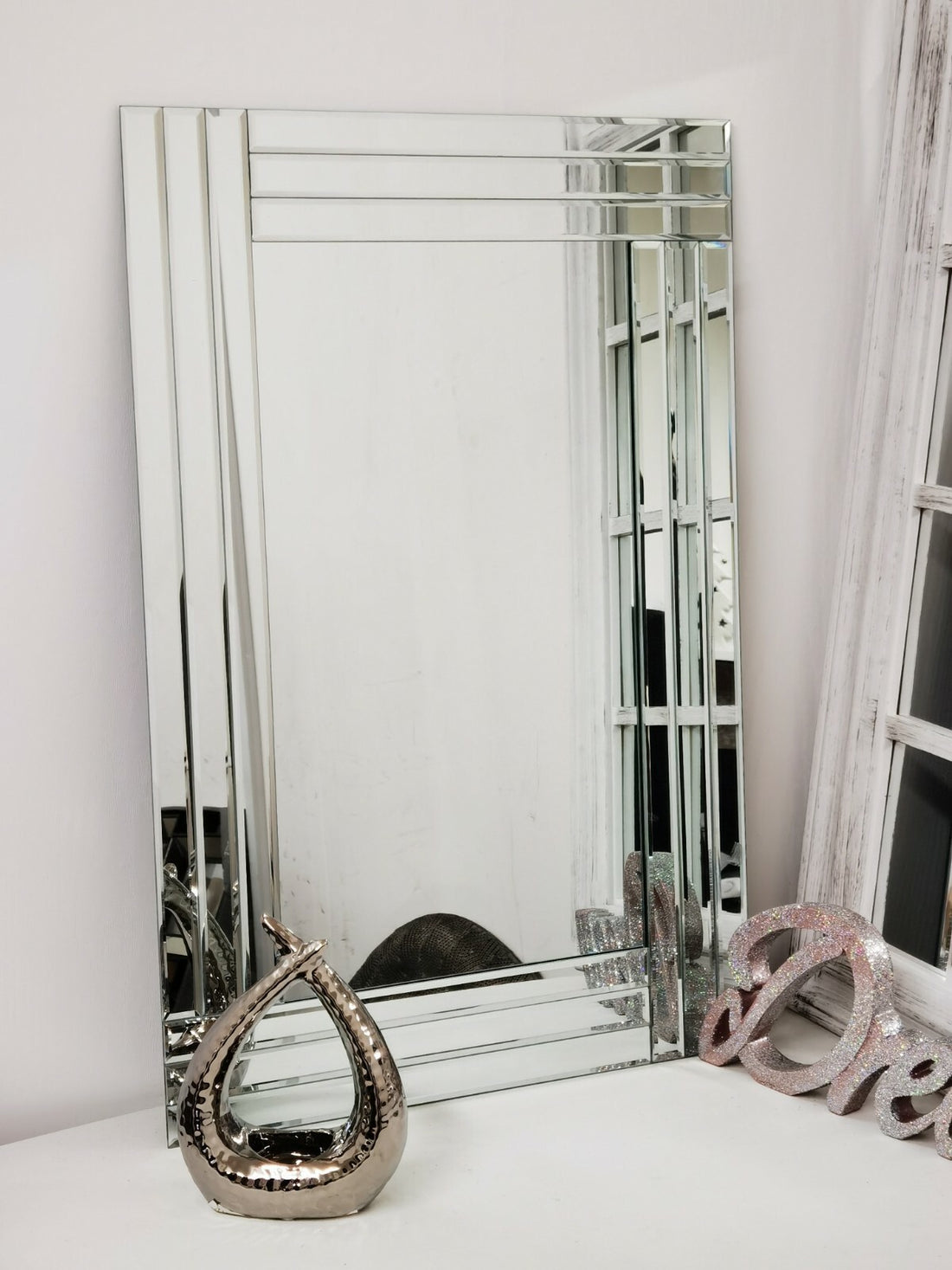 Frameless bevelled wall mirror elegant design